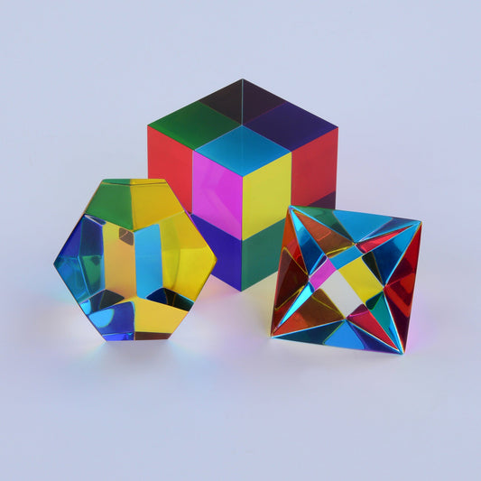 Three translucent CMY solids overlapping, producing a magenta that appears in no rainbow