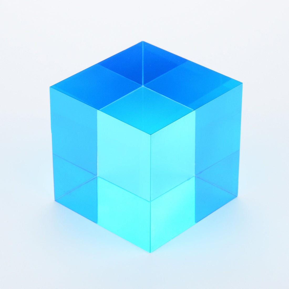 A single cyan translucent cube, the same kind of colour filter used in red-cyan 3D glasses